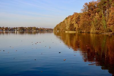 Scenic view of lake against sky during autumn