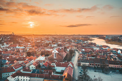 High angle view of city at sunset