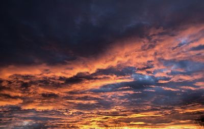 Low angle view of dramatic sky during sunset