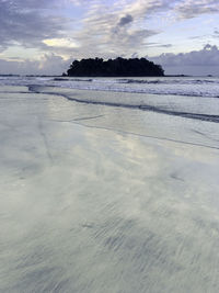 Scenic view of beach against sky