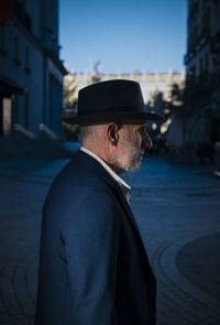 Portrait of adult man in suit and hat on street. madrid, spain