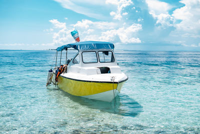 Boat in sea against sky