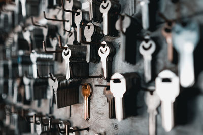 Close-up of keys hanging on wall