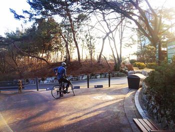 People riding bicycle on road