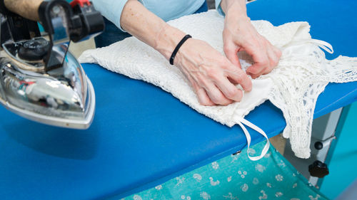 Midsection of woman holding hands