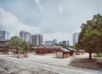 Buildings in city against sky