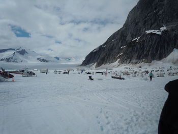 Scenic view of snow covered mountains against sky