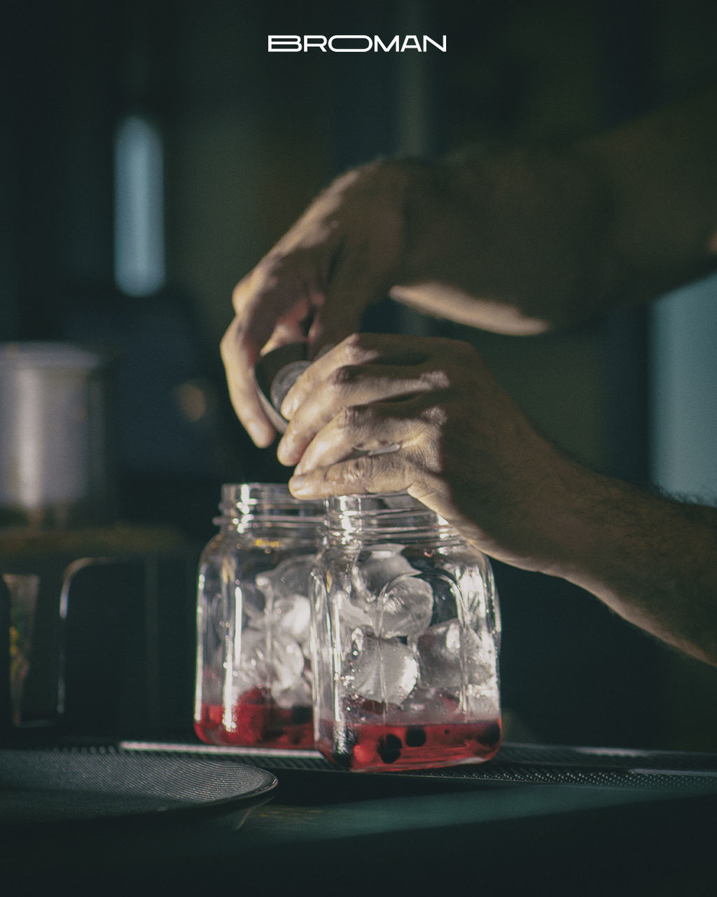 hand, one person, glass, indoors, adult, food and drink, bottle, jar, container, drink, occupation, business, alcohol, table, alcoholic beverage, holding, food, focus on foreground, refreshment