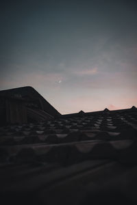 Scenic view of desert against sky at sunset