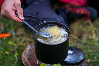 Close-up of hand holding drink