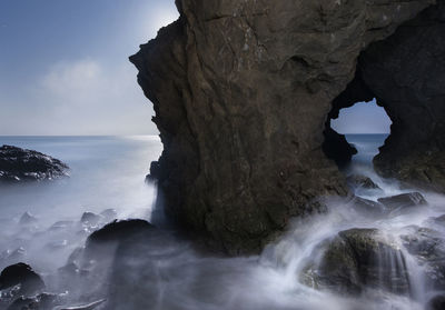 Pacific waves crash through a sea cave at leo carillo state park