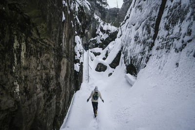 High angle view of person on snow covered land