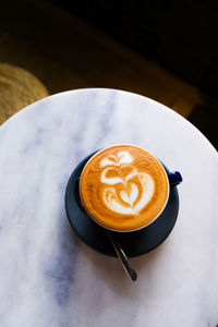 High angle view of cappuccino on table