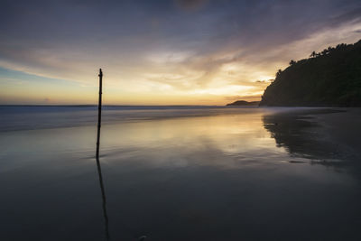 Scenic view of sea against sky at sunset