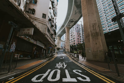 Stop sign on road in city