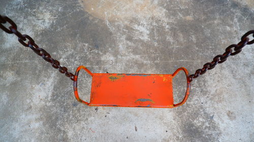 High angle view of swing hanging on wall