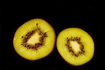 Close-up of fruits against black background