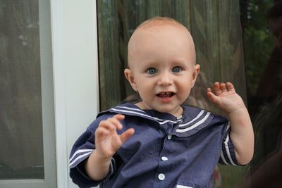 Portrait of smiling baby boy at back yard