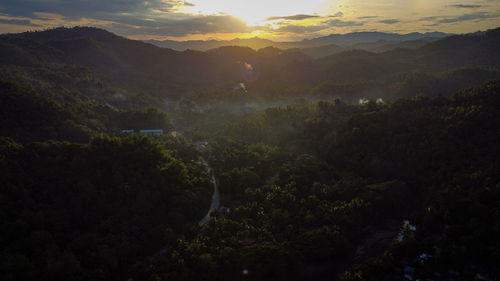 High angle view of mountains against sky during sunset