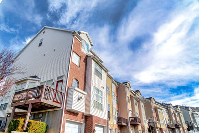 Low angle view of multi colored buildings against sky