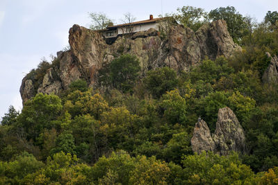 Low angle view of rock formation against sky