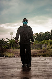 Full length of man standing against sky