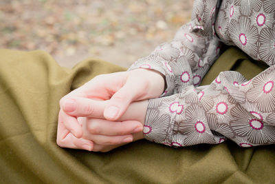 Close-up of woman holding hands