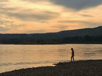 Scenic view of lake against sky during sunset