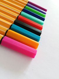 High angle view of colorful pencils on table