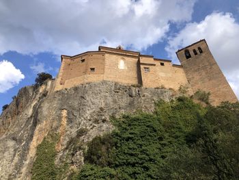 Low angle view of old ruins against sky