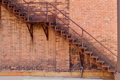 Steps against red brick wall