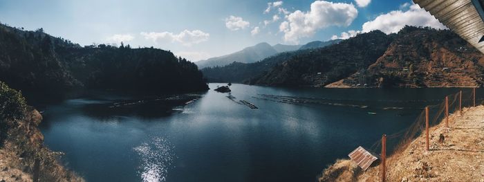 Panoramic view of lake and mountains against sky