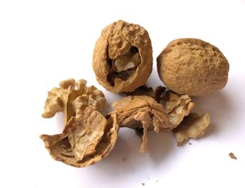 Close-up of dried fruits against white background