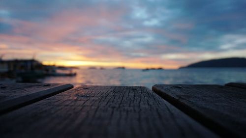 Close-up of wood against sky during sunset