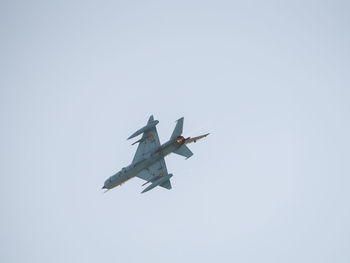 Low angle view of airplane against clear sky