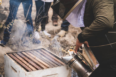 Low section of man working at workshop