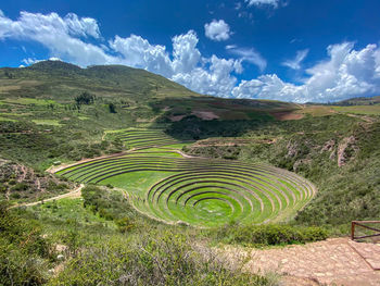 Scenic view of incan agricultural experimental station, blue sky. 