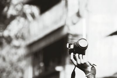 Close-up of hand holding camera