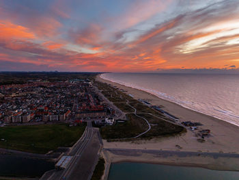 High angle view of city at sunset