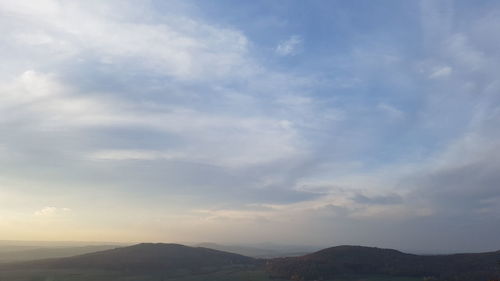 Scenic view of mountains against sky during sunset