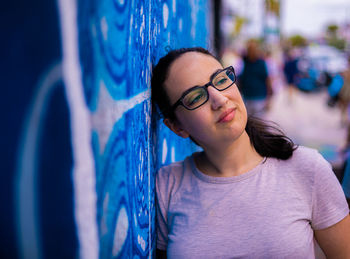 Portrait of young woman wearing sunglasses