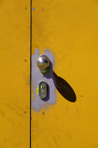Close-up of yellow door