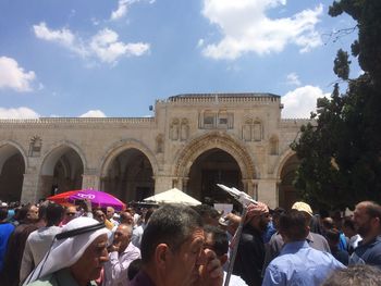 Group of people in front of historical building