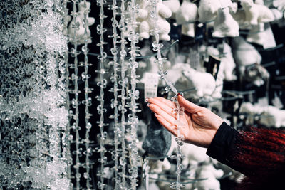 Cropped hand of woman holding water