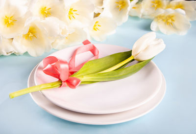 High angle view of rose petals on table