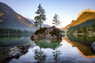 Scenic view of lake and mountains against clear sky