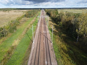 Panoramic shot of road amidst land against sky