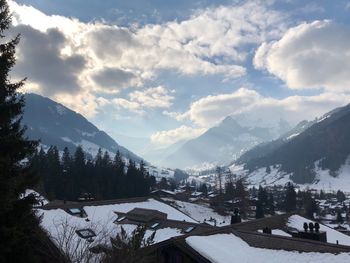 Scenic view of snowcapped mountains against sky