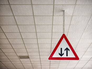 Low angle view of arrow symbols on ceiling