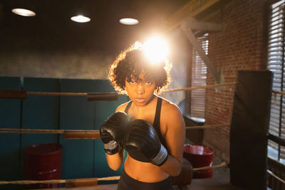 Young woman exercising in gym